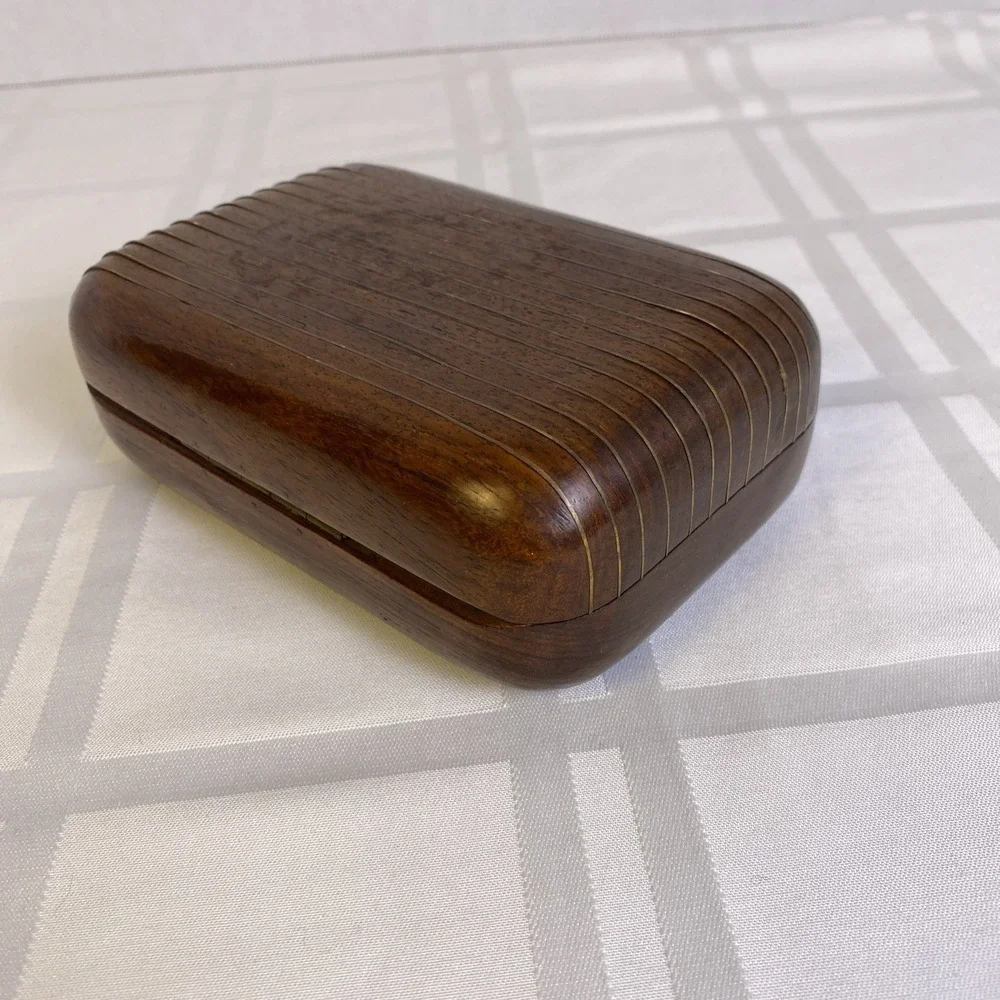 Hand carved 2 piece wood box with metal hinge, hook and metal ribs on lid